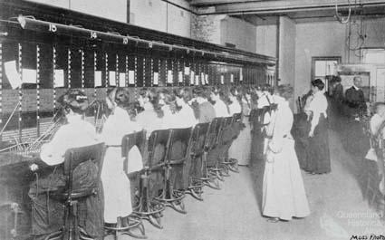 Rows of telephonists seated at a magneto switchboard in the Brisbane central manual telephone exchange, 1910.